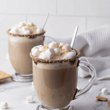 Enjoy the ultimate cozy treat with this S’mores Hot Chocolate Starbucks Copycat! Creamy hot chocolate topped with toasted marshmallows and graham cracker crumbs for a campfire-inspired drink at home.