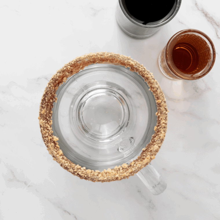 Milk and heavy cream heating in a small saucepan.