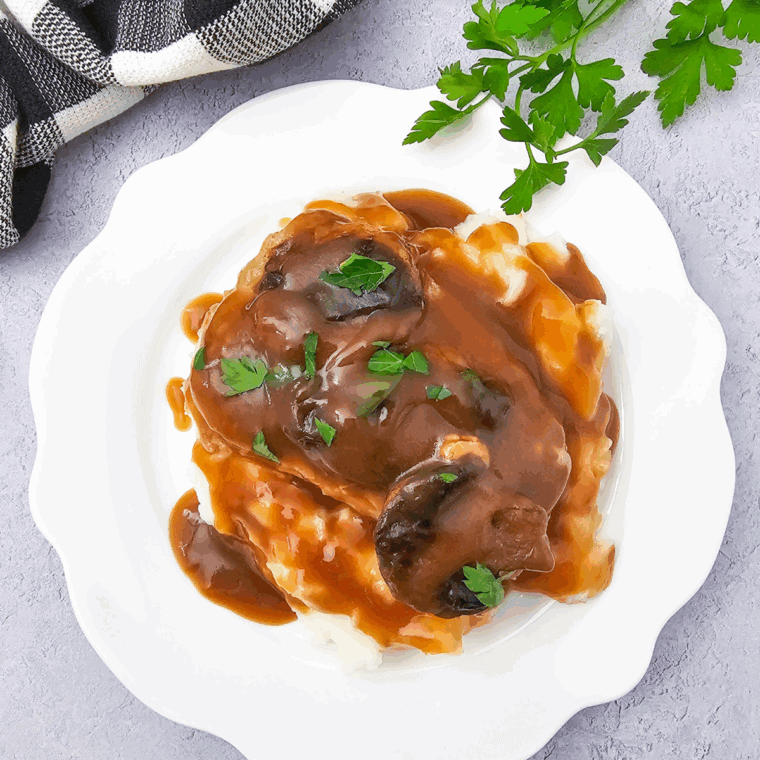 Rich, homemade Texas Roadhouse style brown gravy served over mashed potatoes or country fried steak.