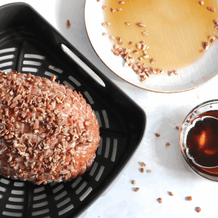 Ham placed in the air fryer basket cooking to 145°F internal temperature.