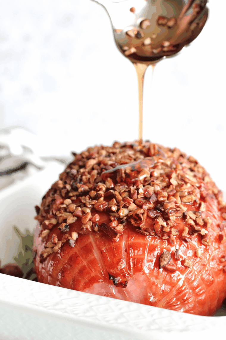 Air fryer Christmas ham plated with festive sides for holiday dinner.