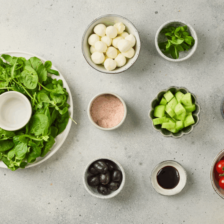 Ingredients needed for Easy Christmas Wreath Salad on kitchen table.