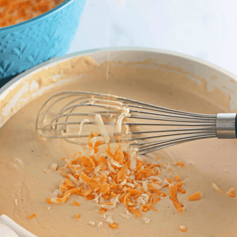 Gradually adding milk and heavy cream, stirring until slightly thickened.