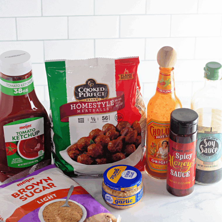 Ingredients needed for Easy Crock Pot Frozen Meatballs on kitchen table.