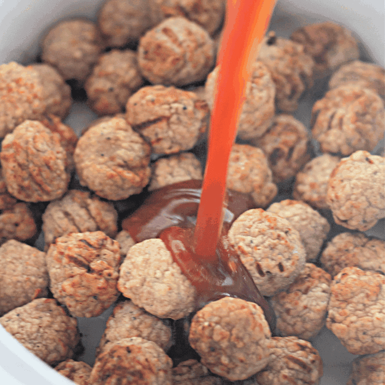 Place frozen meatballs into the slow cooker.