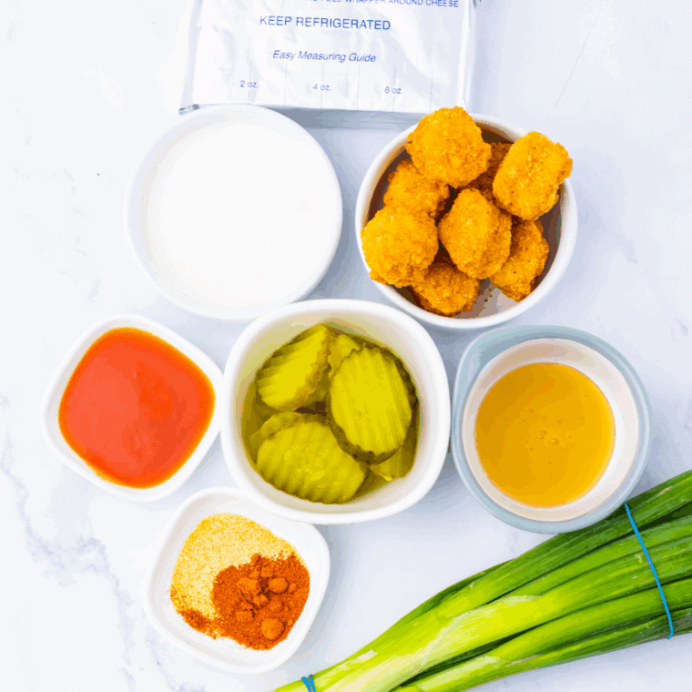 Ingredients needed for Easy Nashville Hot Chicken Dip on kitchen table.