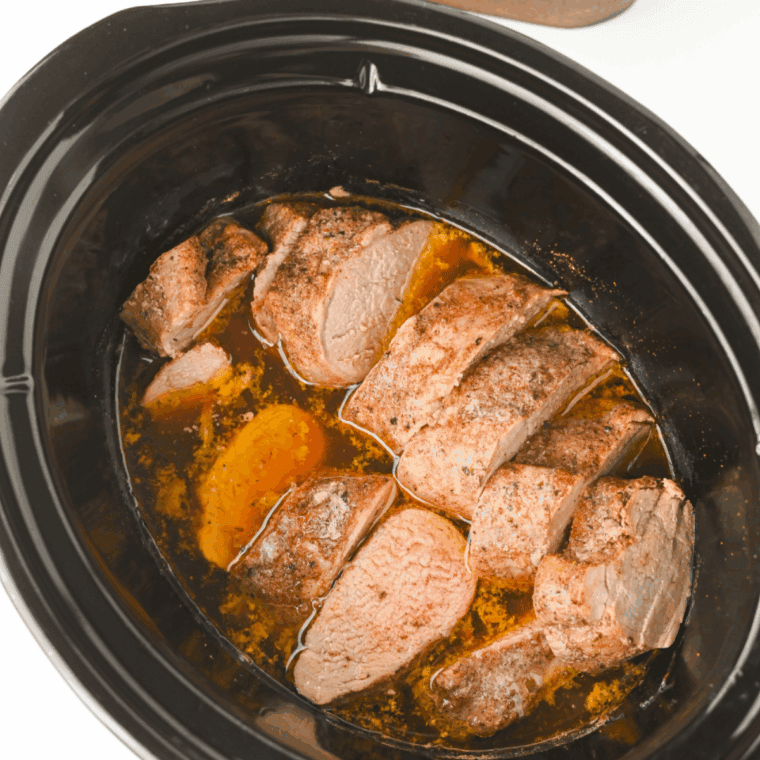 Cooked pork tenderloin in the slow cooker after cooking on low until tender