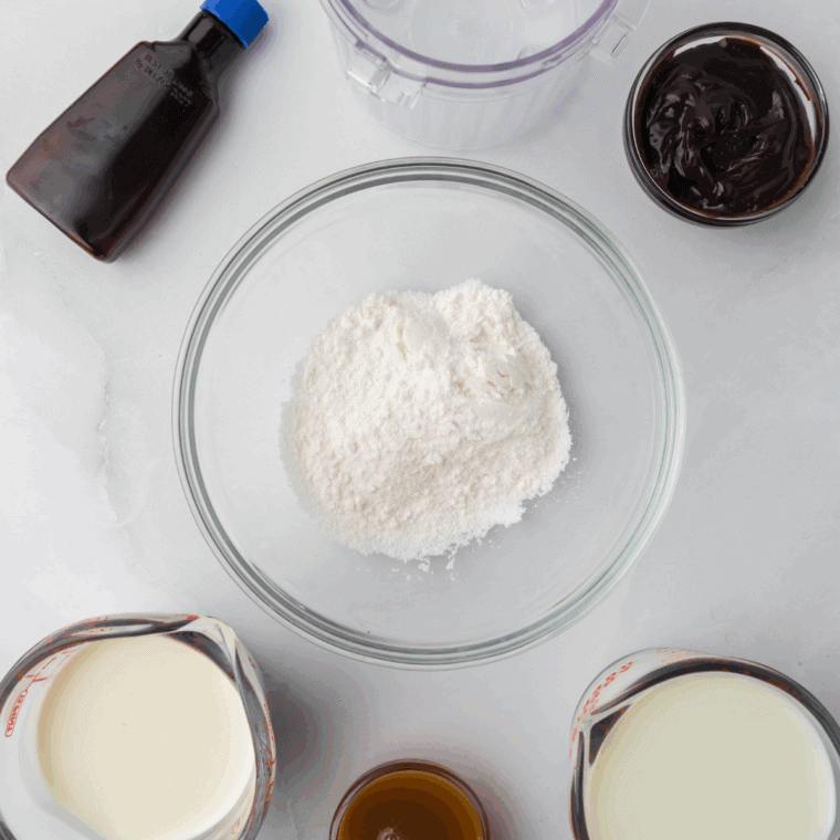 Ingredients needed for Ninja Creami Ben and Jerry’s Vanilla Caramel Fudge on kitchen table.
