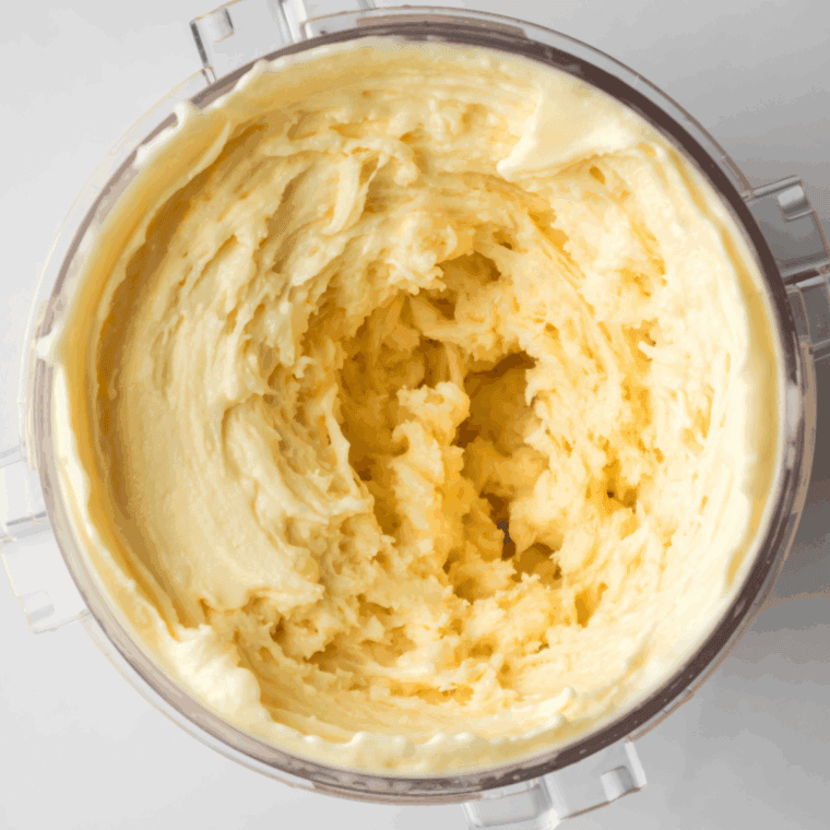 Frozen ice cream base placed in Ninja Creami ready to process