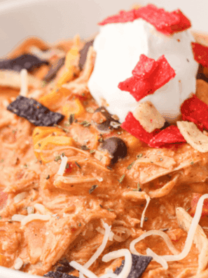 Bowl of creamy Ruby Tuesday white chicken chili topped with cheese and cilantro.