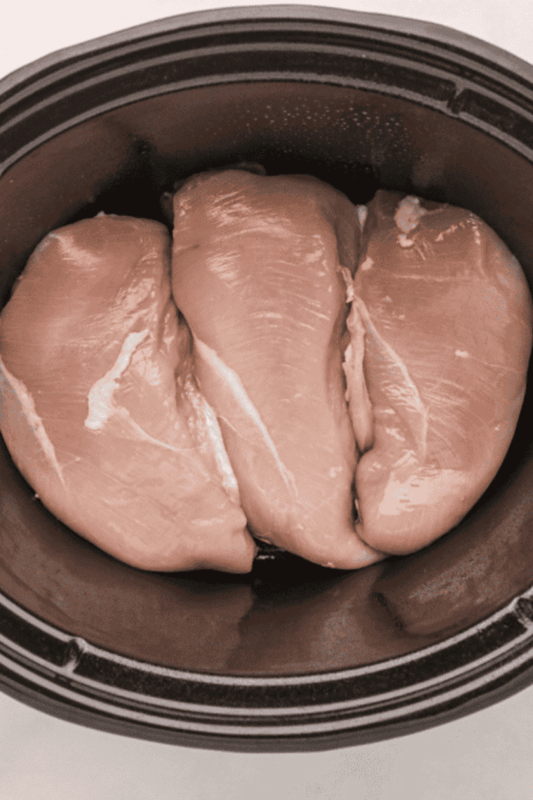 Place the chicken in the bottom of the crockpot.