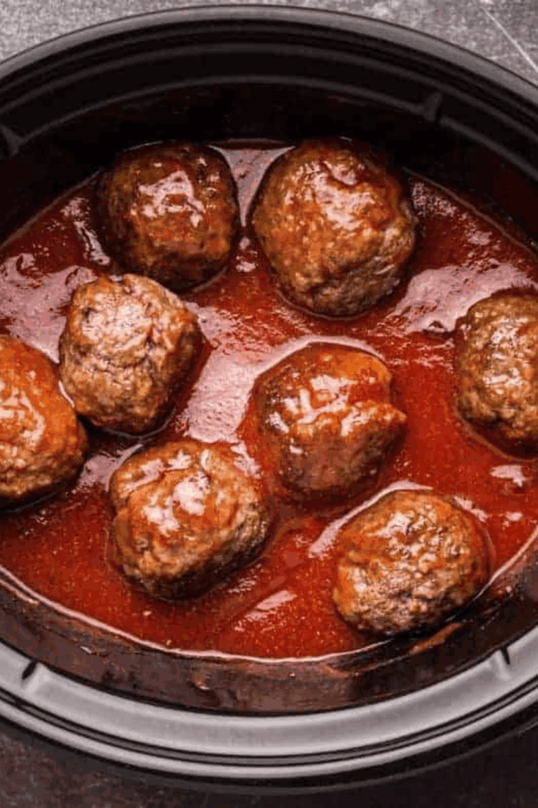 “Slow cooker marinara sauce simmering with tomatoes, garlic, and herbs in a crockpot.”