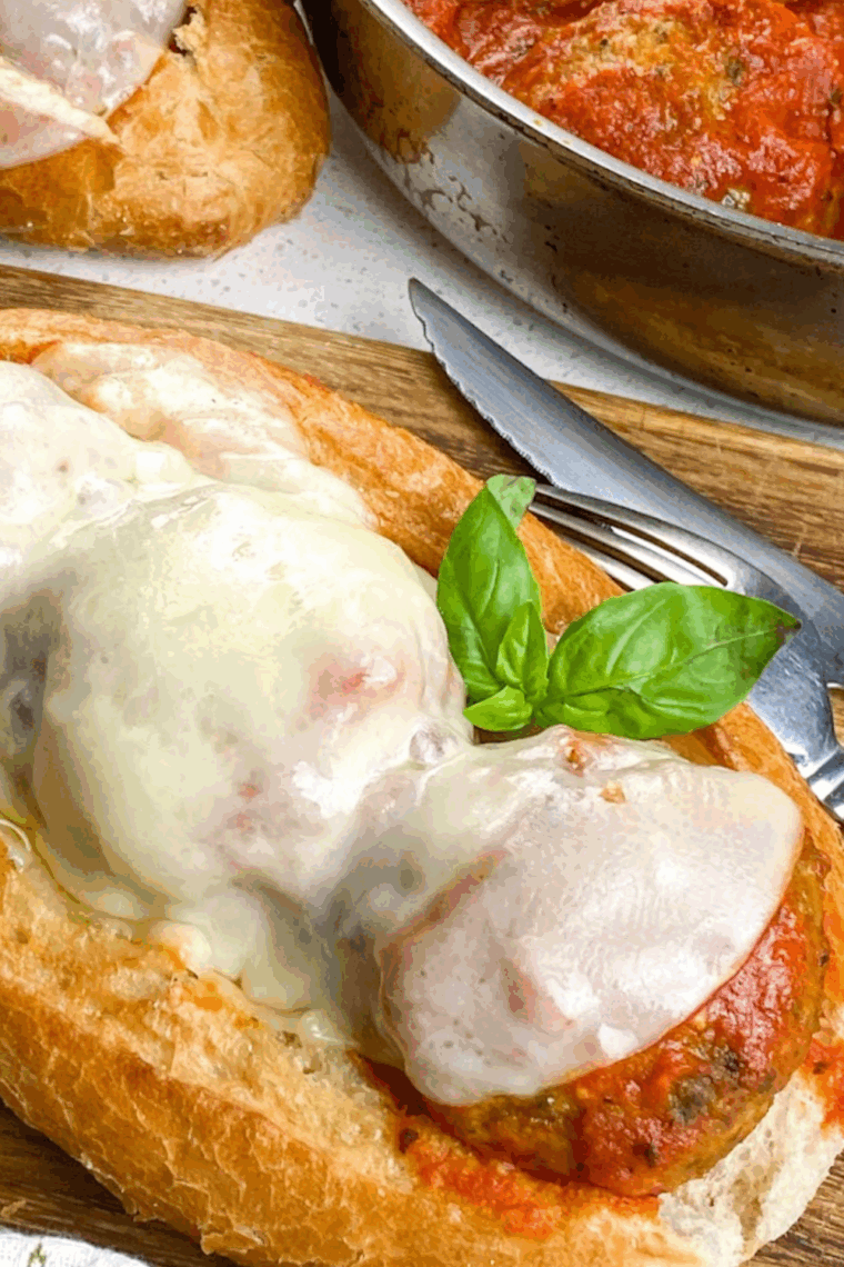 slow cooker filled with homemade marinara sauce simmering with tomatoes, garlic, onions, and herbs