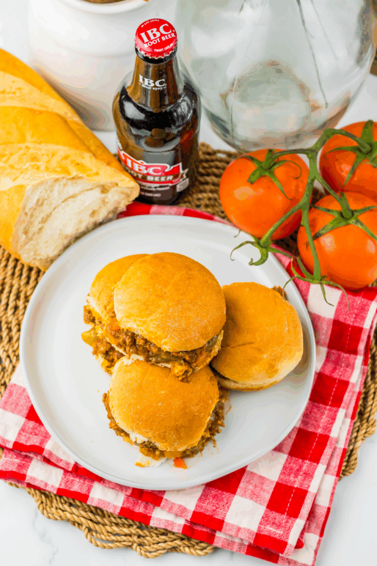 Mini Slow Cooker Root Beer Sloppy Joe Sliders on buns with juicy, saucy beef filling, ready to serve.