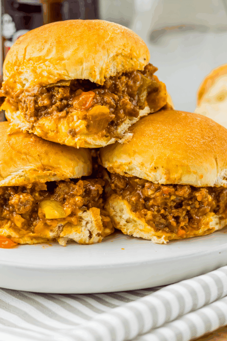 Slow Cooker Root Beer Sloppy Joes on buns with juicy, saucy beef filling, ready to serve.