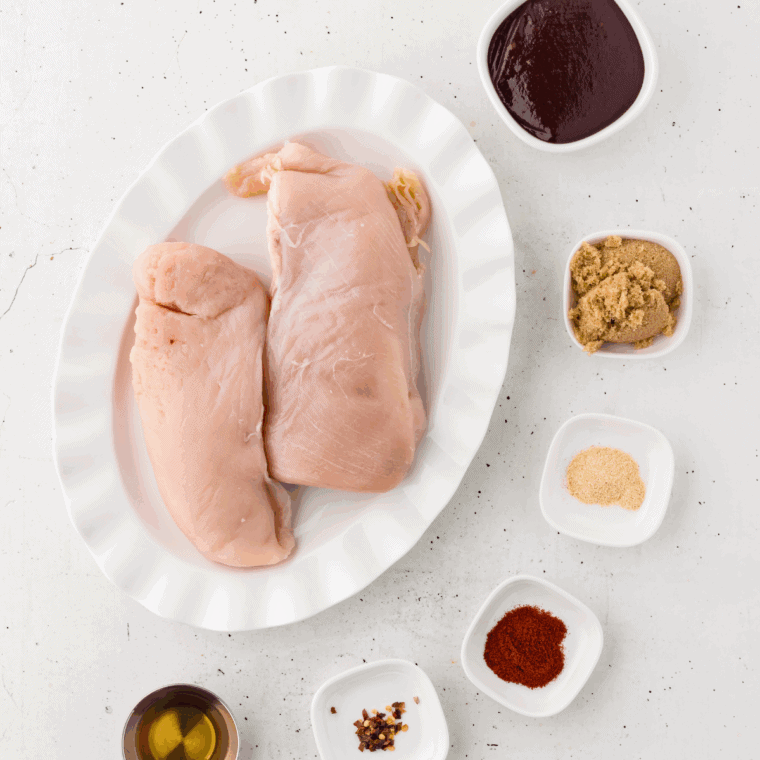 Ingredients needed for Slow Cooker Sweet Baby Rays Chicken on kitchen table.