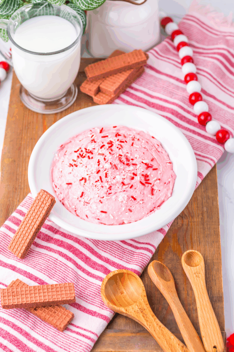 Valentine&rsquo;s Day Fluff dessert served in a bowl with pink coloring, sprinkles, and chocolate wafer cookies