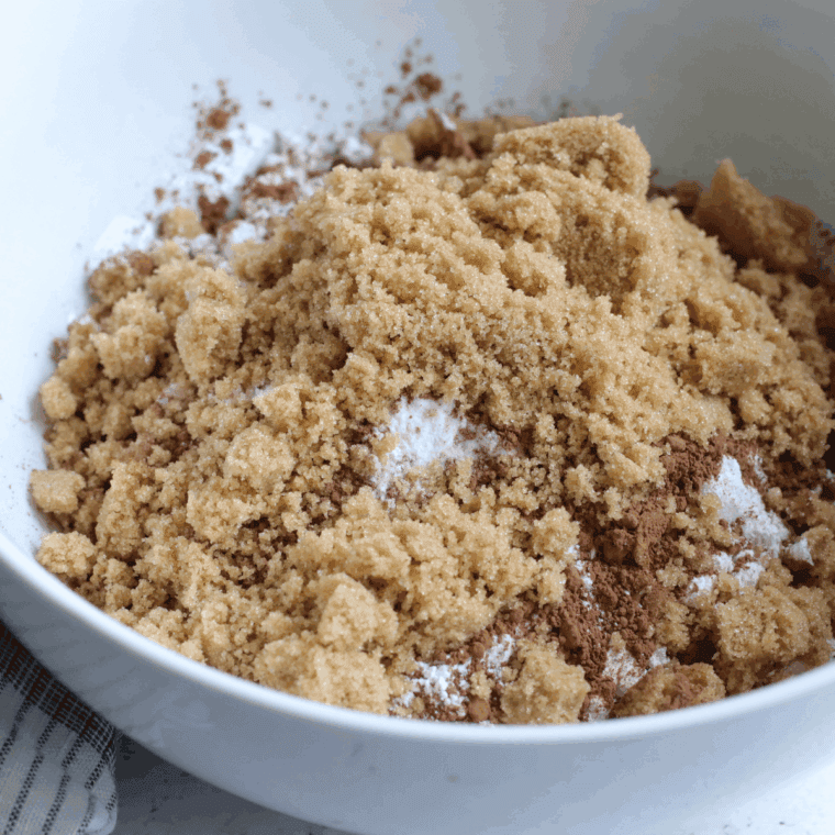 Brown sugar and butter being creamed together in a large bowl, then vanilla, egg, and milk added.