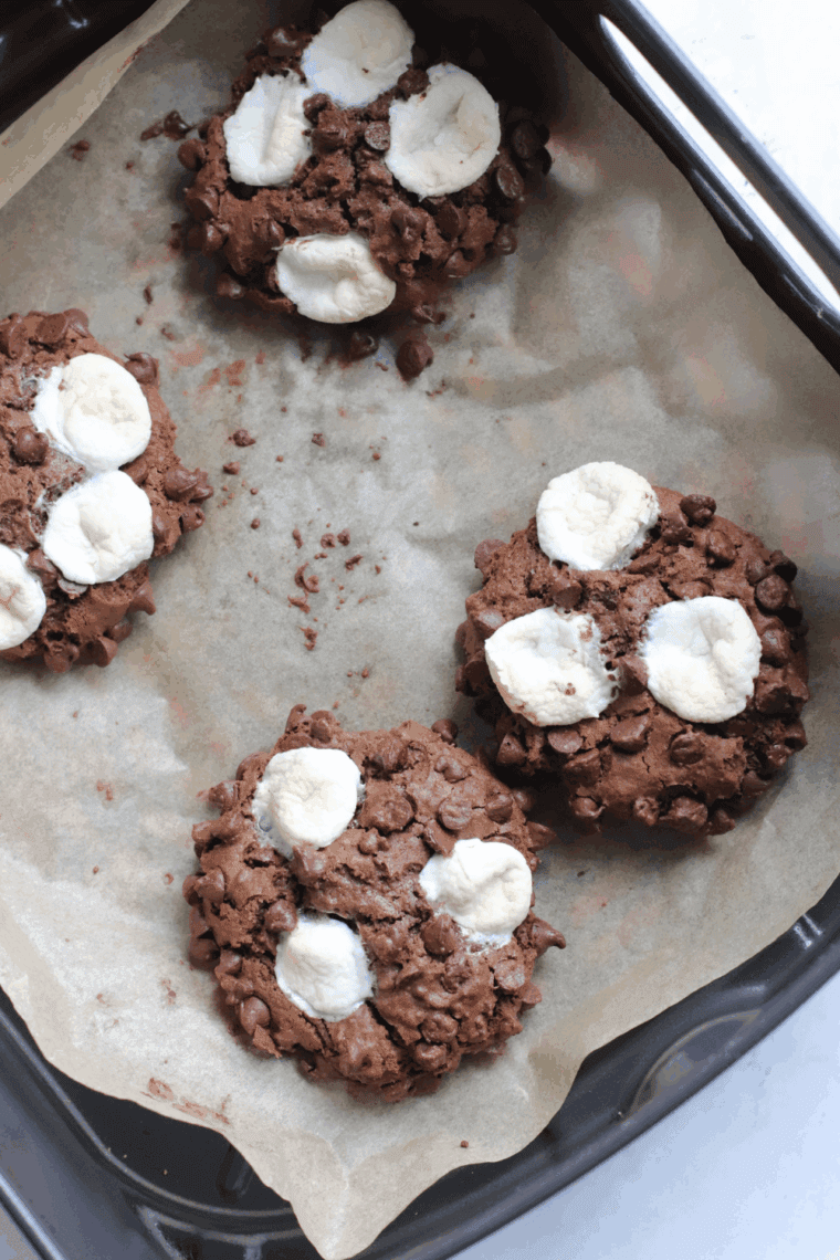 Chocolate cookies with gooey caramel centers and melted marshmallows fresh from the air fryer.