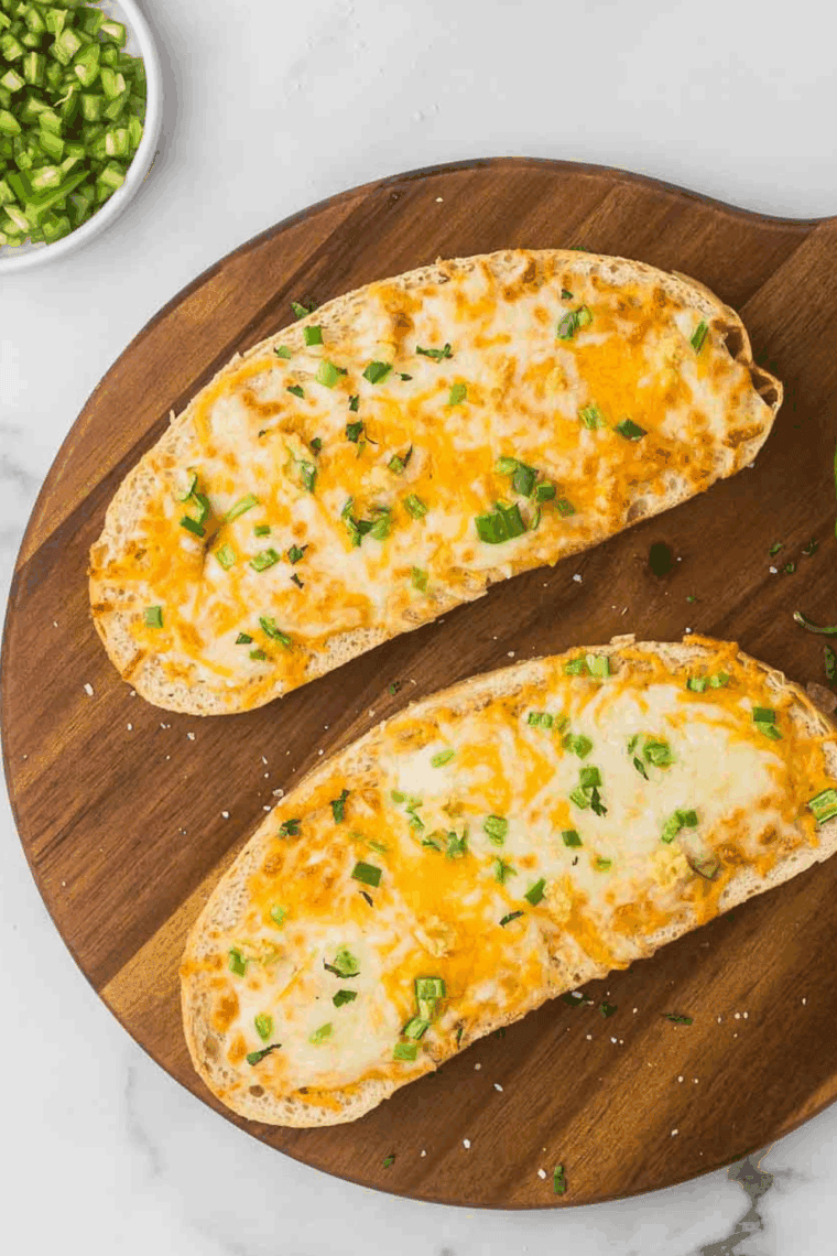 Golden, crispy air fryer cheese on toast with melted, bubbly cheese.