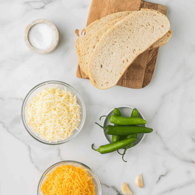 Ingredients needed for Air Fryer Cheese on Toast on kitchen table.