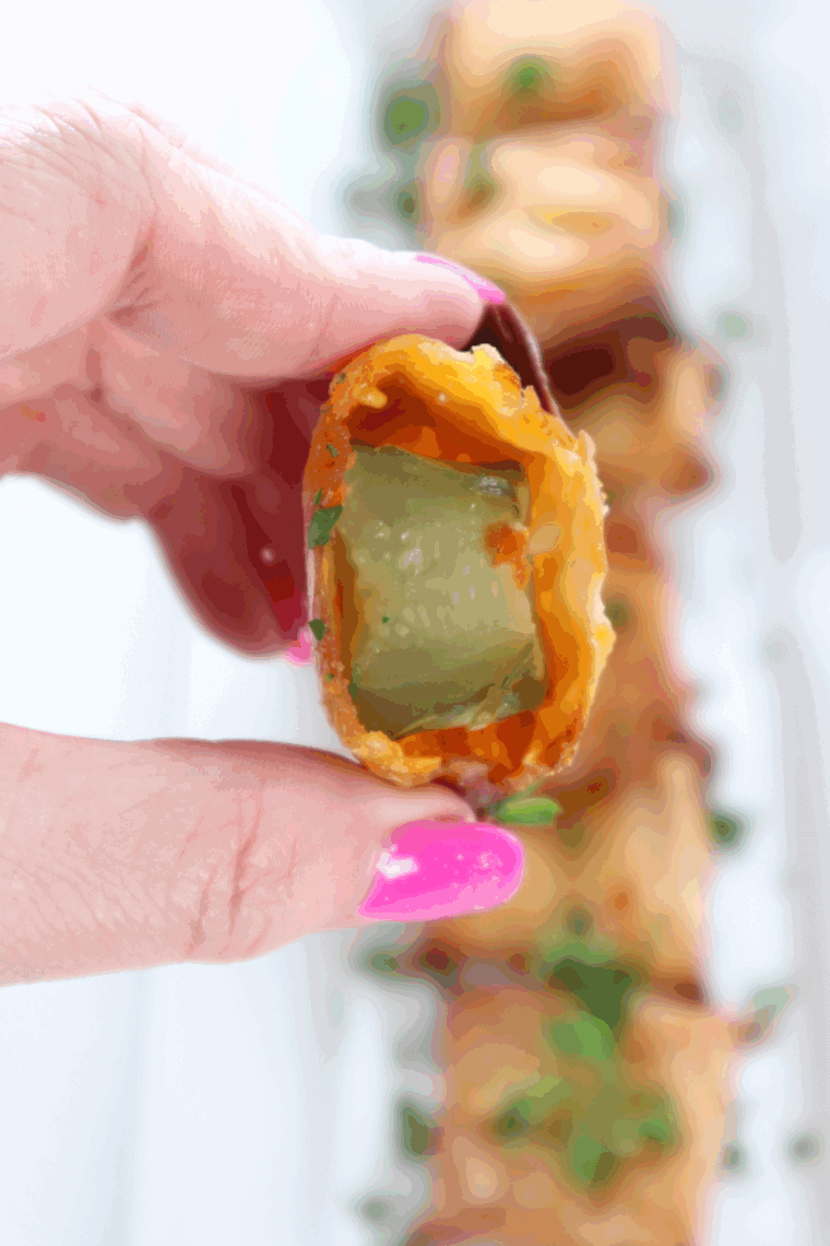 Golden crispy air fryer wontons stuffed with melted cheese and tangy pickles
