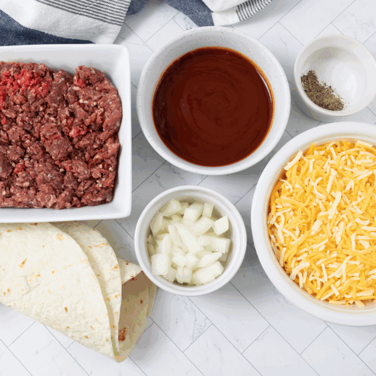 Ingredients needed for Blackstone Griddle Taco Meat on kitchen table.