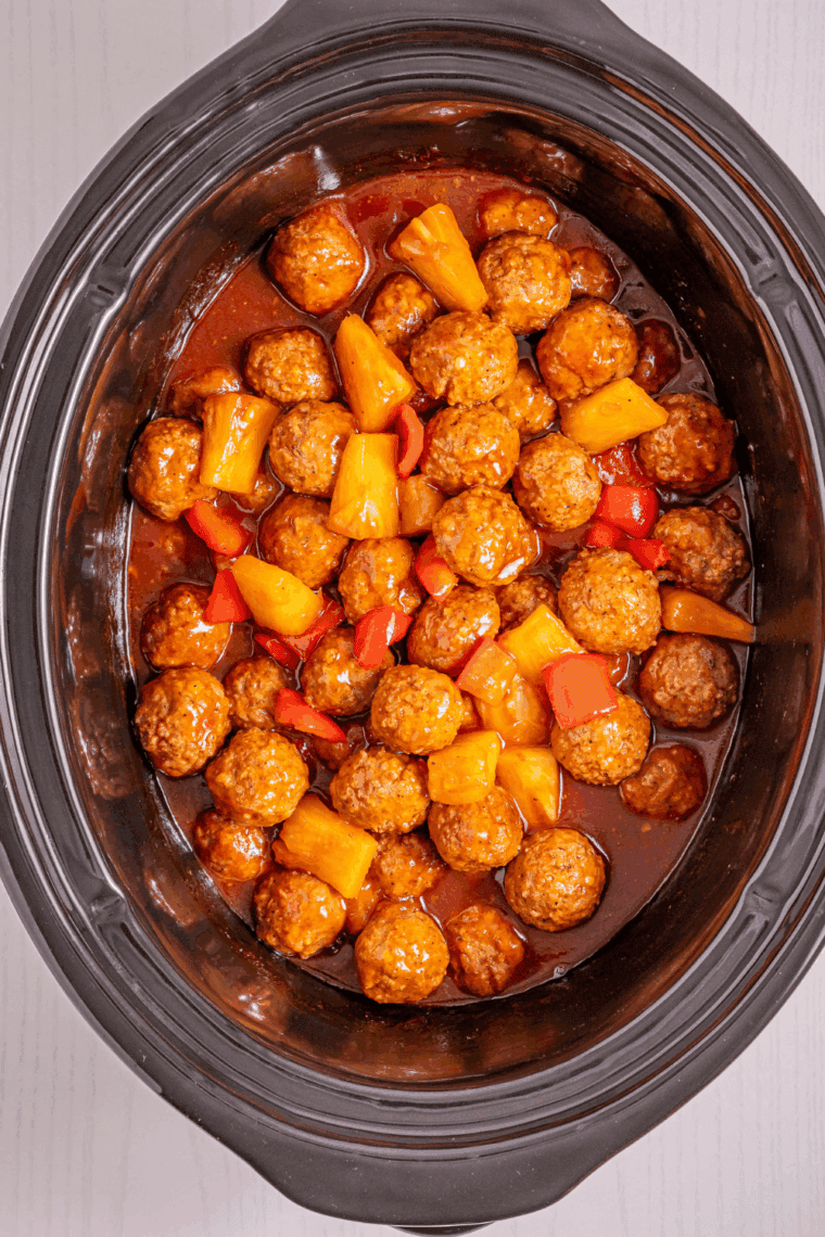 BBQ sauce mixture poured over meatballs and gently stirred