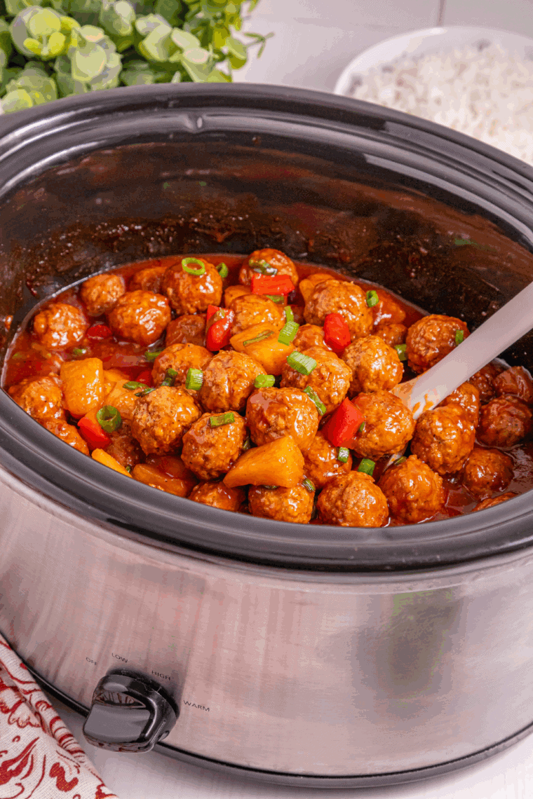 Crock pot Hawaiian meatballs with pineapple and BBQ sauce in slow cooker