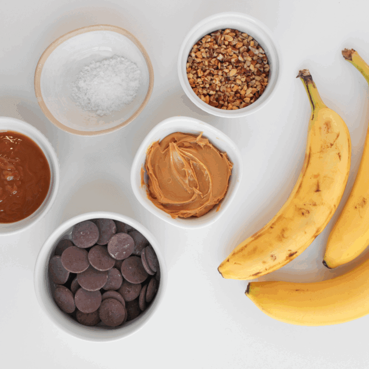 Ingredients needed for Easy Frozen Banana Snickers Bites on kitchen table.
