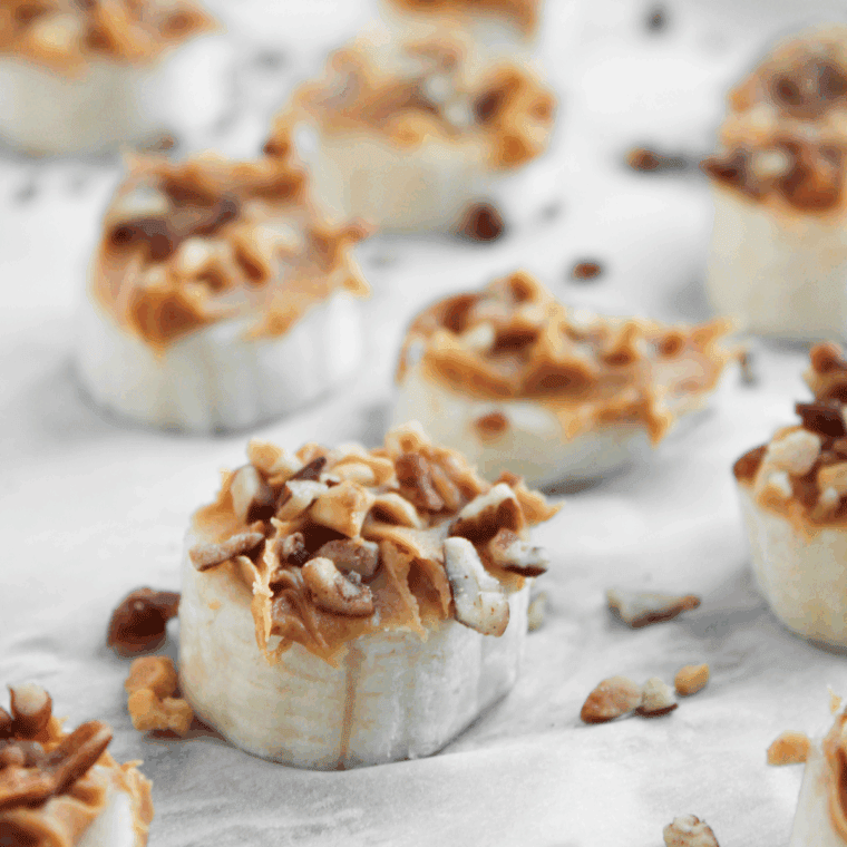 Sprinkle crushed peanuts on top and drizzle lightly with caramel sauce.
