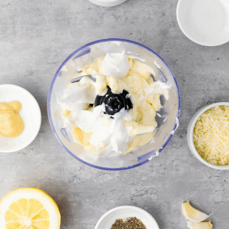 Whisk mayonnaise, Parmesan, garlic, Dijon, Worcestershire, lemon juice, hot sauce, salt, and pepper in a bowl.