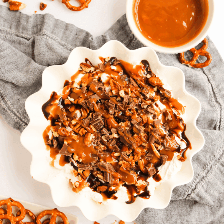 Adding extra caramel drizzle and finishing with flaky sea salt.