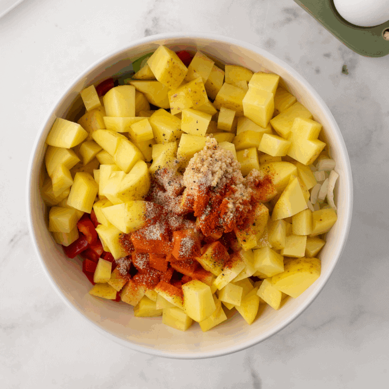 Wash, peel, and dice potatoes; chop chicken, bell peppers, onions, mushrooms, and roughly chop spinach into bite-sized pieces.