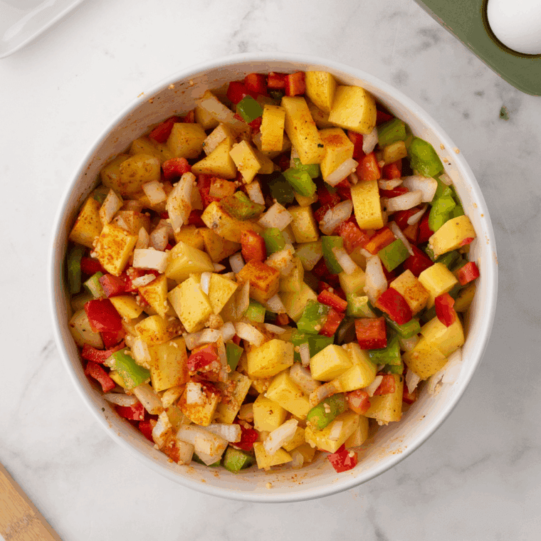Heat skillet with butter or oil, cook potato cubes until golden and crispy, stirring occasionally.