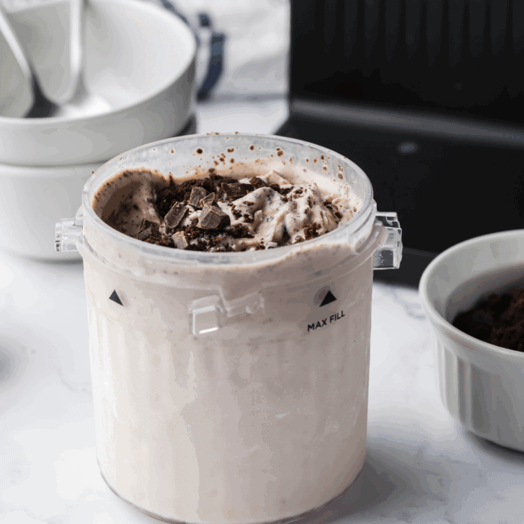 Homemade Ninja Creami chocolate concrete in a bowl with candy chunks