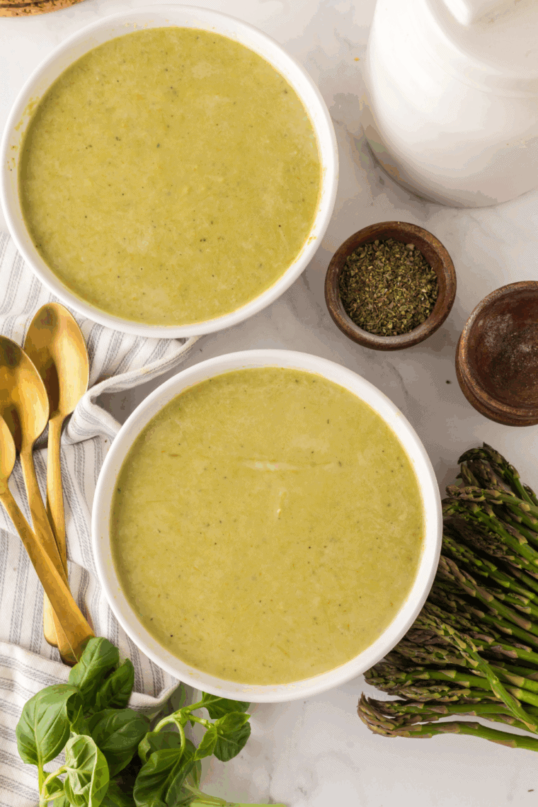 The Ninja Foodi multi-cooker filled with a smooth, blended asparagus soup ready to be served.
