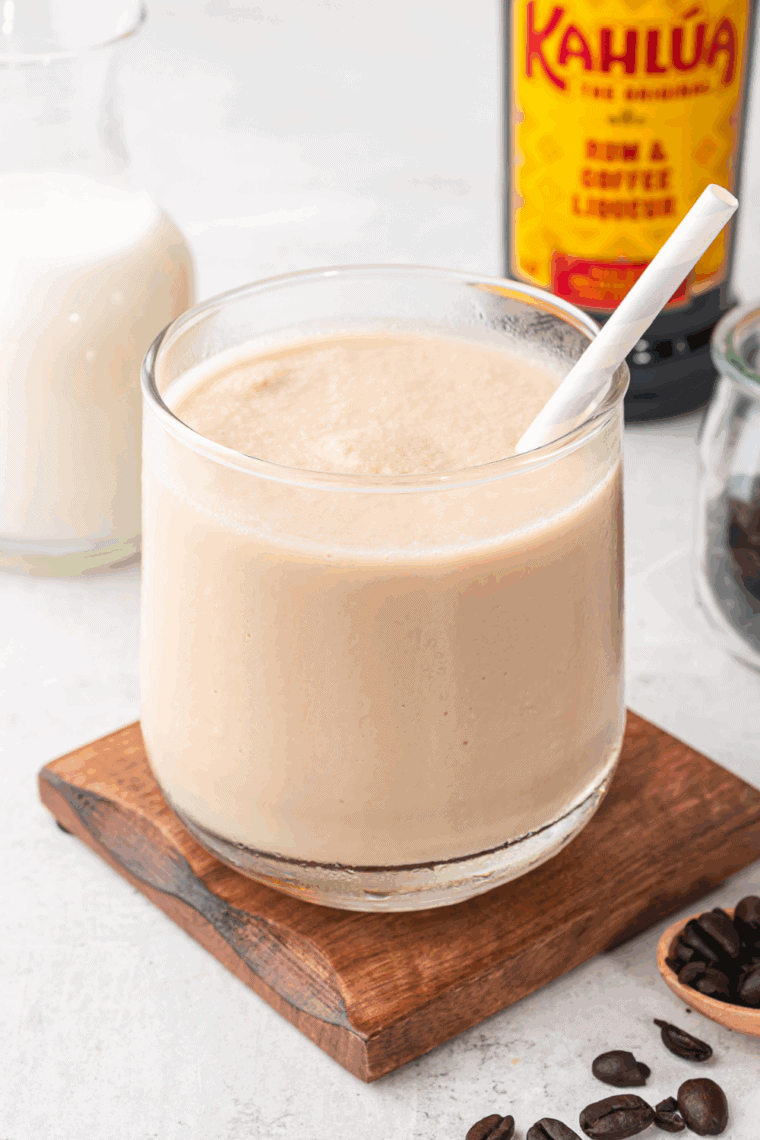 Frosty Ninja Slushi Frozen White Russian cocktail in a glass, topped with ice and ready to serve