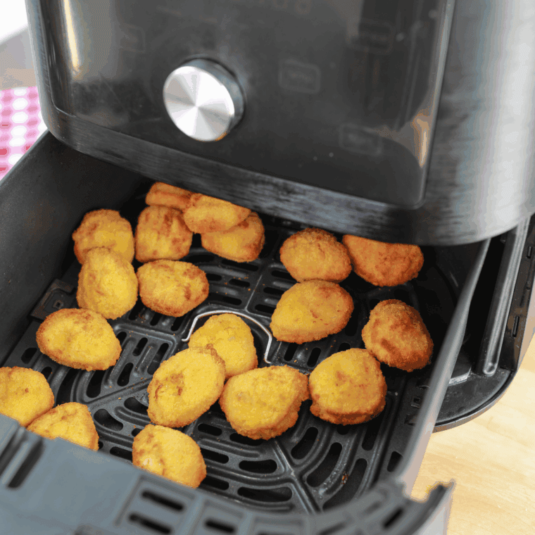 Flipping chicken nuggets halfway through air fryer cooking