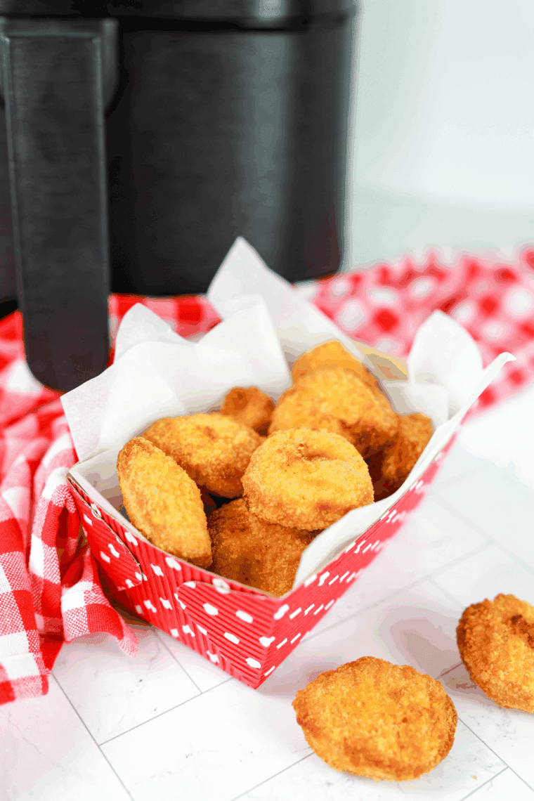 Tyson chicken nuggets cooking in air fryer basket crispy and golden