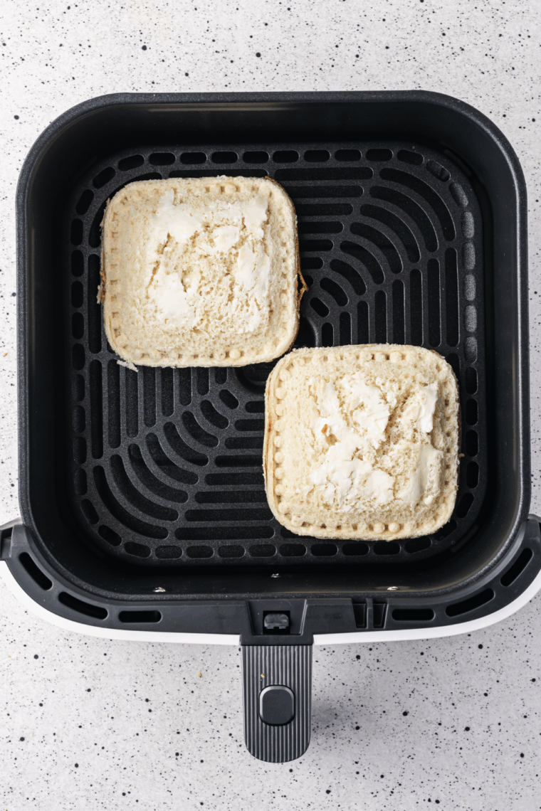 Easy Air Fryer DIY Frozen Uncrustables are a quick, fun, and kid-friendly snack. Make your own peanut butter and jelly pockets at home with this simple air fryer recipe.