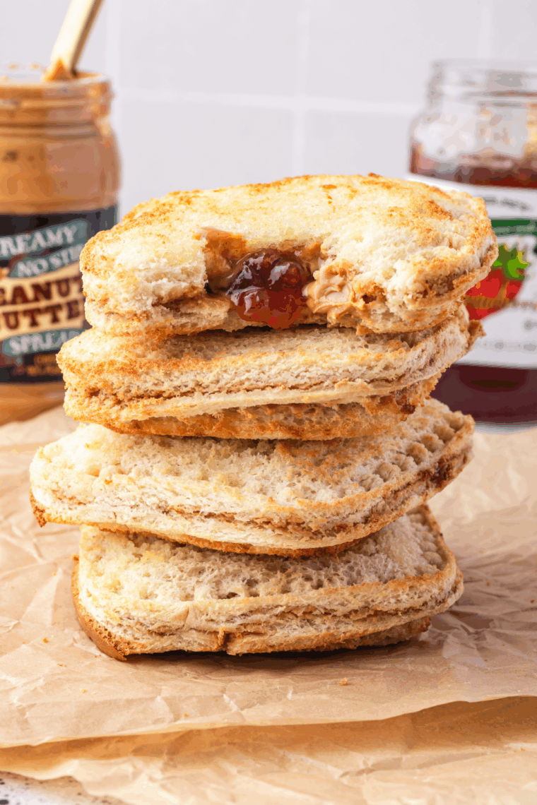 Air Fryer DIY Frozen Uncrustables with peanut butter and jelly filling, golden and warm