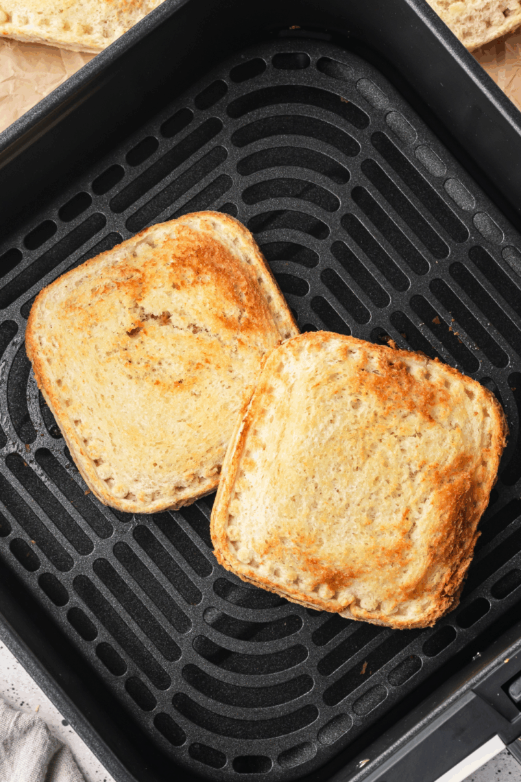 Air Fryer DIY Frozen Uncrustables with peanut butter and jelly, golden and warm