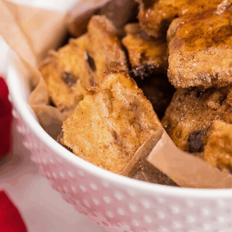 Air fryer French toast bites, golden and crispy, served with syrup