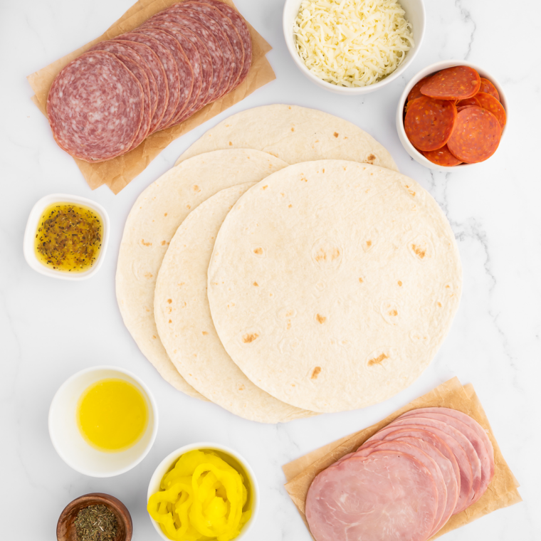 Ingredients needed for Easy Air Fryer Hot Italian Wraps on kitchen table.