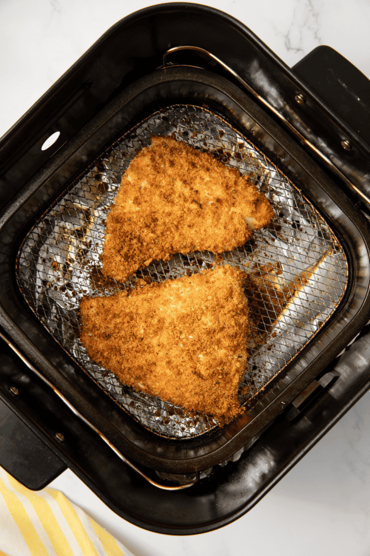 Crispy air fryer panko crusted red snapper served with fresh lemon wedge