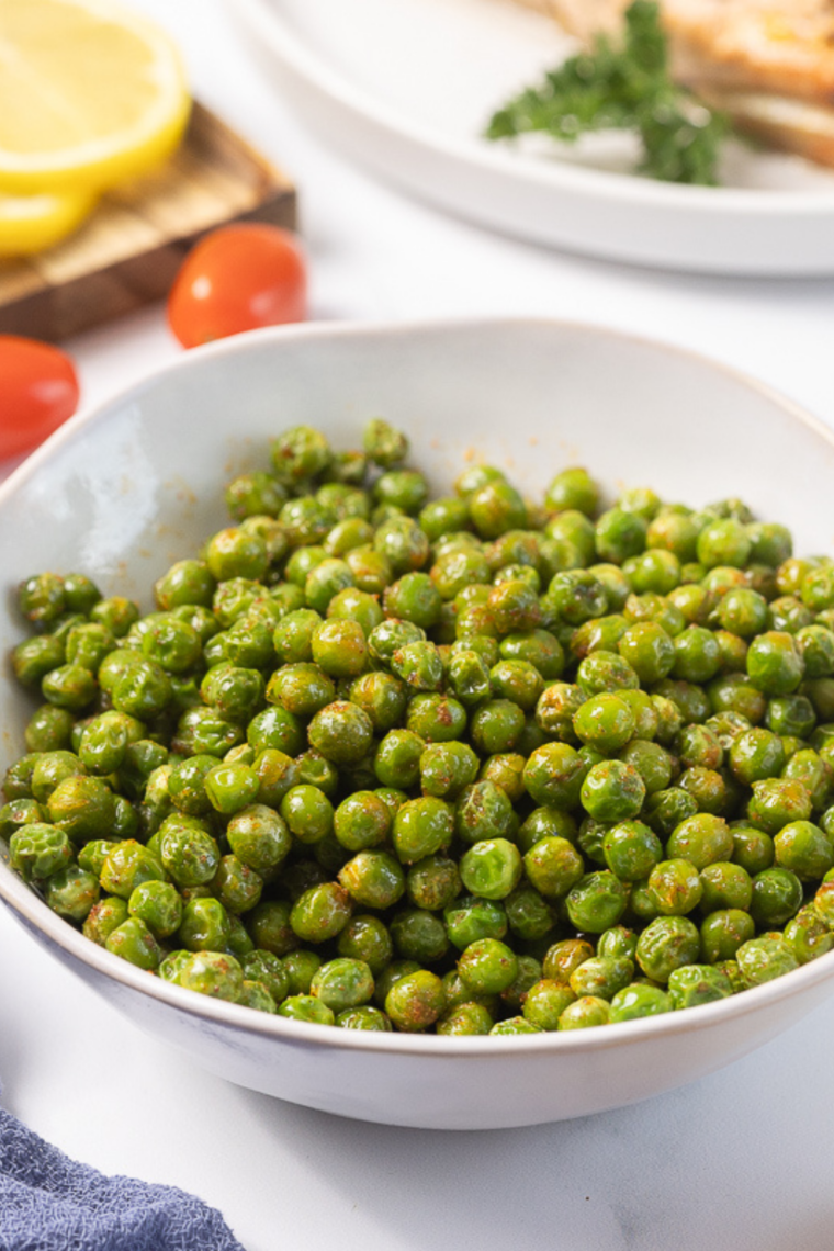 Crispy air fryer wasabi peas in a bowl coated with spicy seasoning, ready to snack