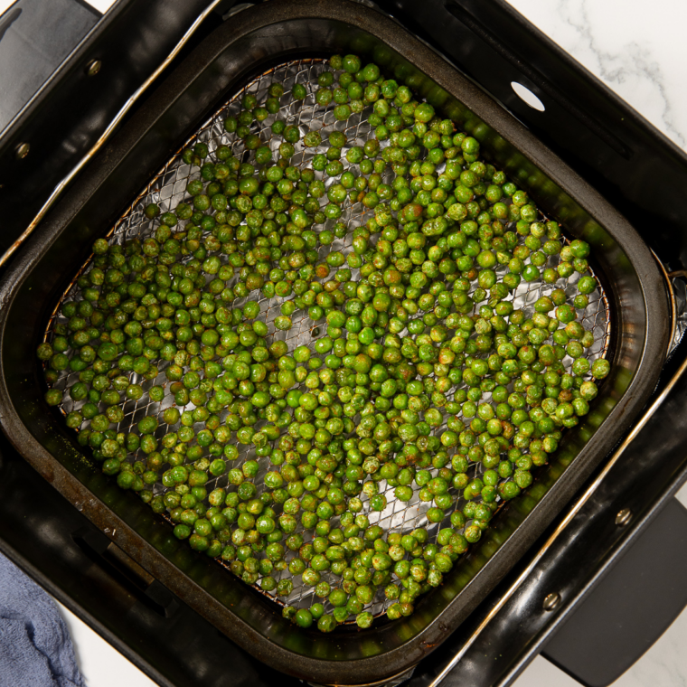 Crispy air fryer wasabi peas cooling in a bowl before serving