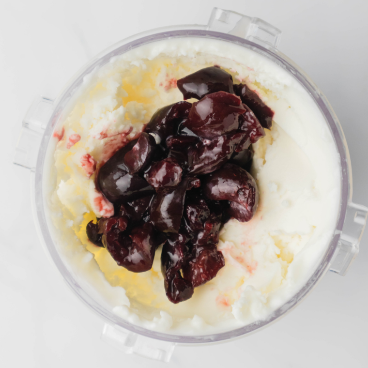 Frozen pint inserted into Ninja Creami, &ldquo;Gelato&rdquo; function selected and churned smooth.