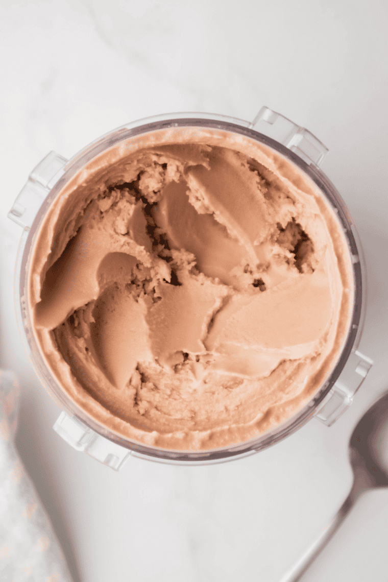 Chocolate gelato being re-spun in Ninja Creami for smoother and creamier texture.